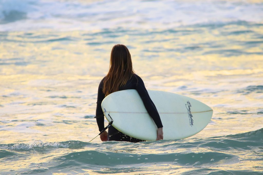 photo of a girl surfing