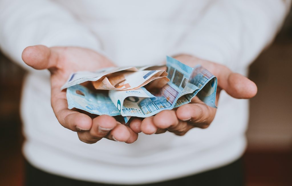 photos of hands holding money