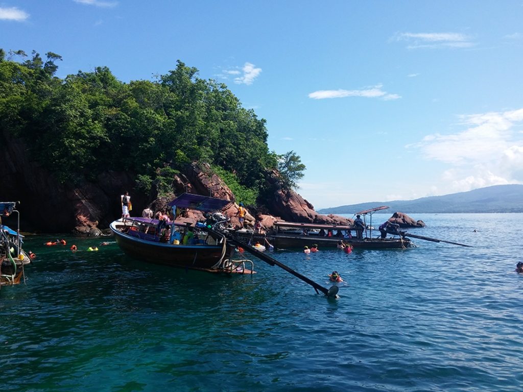 photo of snorkling near an island on Thailand